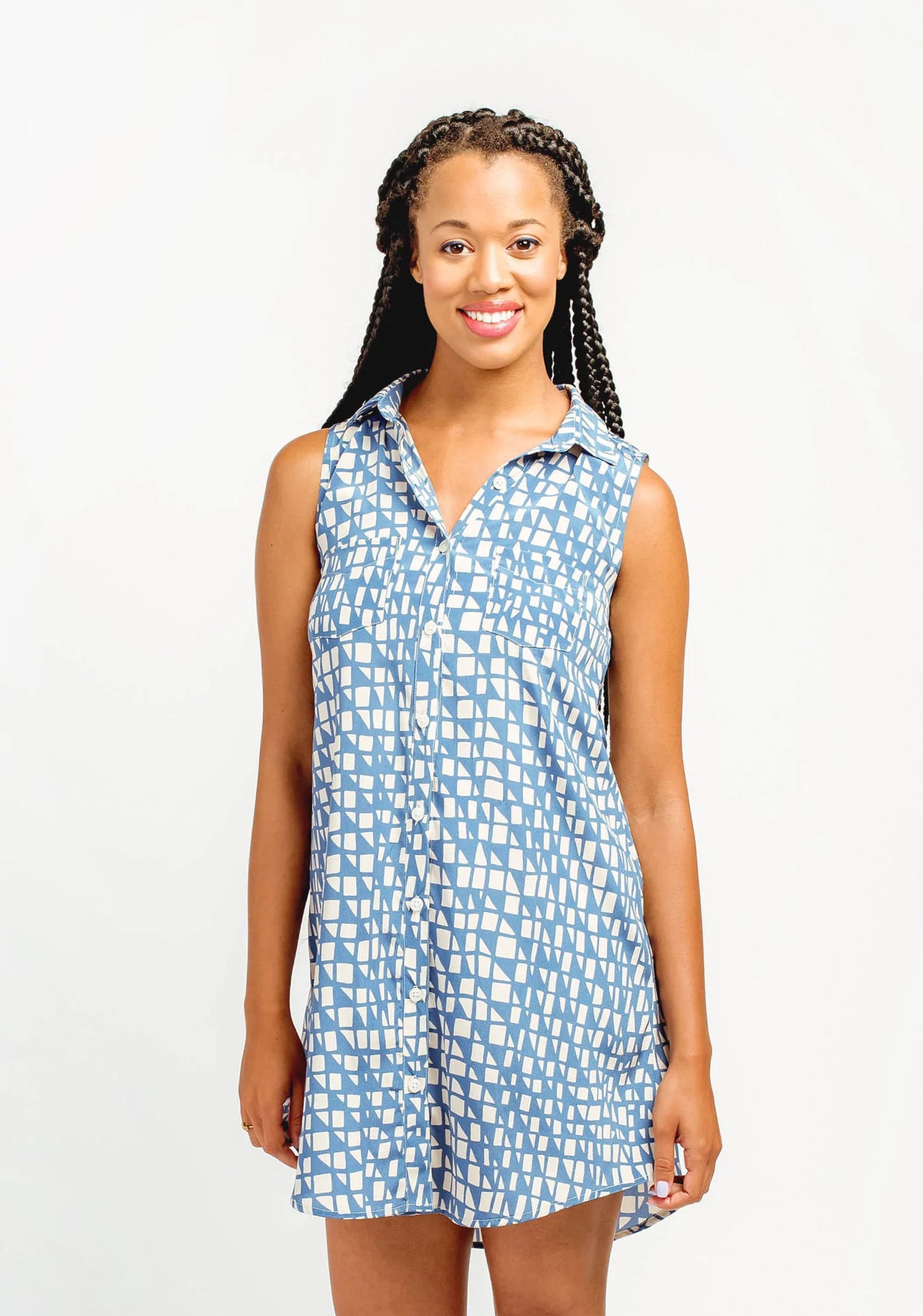 Model Lauren is wearing a size 8, view A Alder Shirtdress in a blue patterned fabric. She is modeling the front side of the shirtdress.